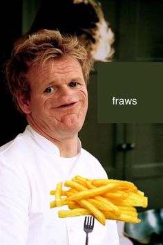 a man holding a fork and knife with french fries on it's side in front of his face