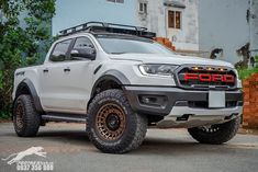 a white truck parked in front of a building