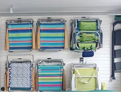 several different types of luggage are hanging on the wall