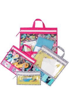 a pink bag filled with lots of different types of paper and crafting supplies on top of each other