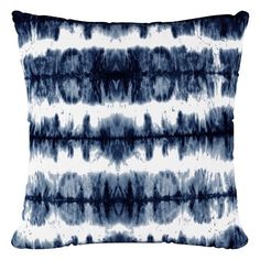 a blue and white pillow that is made from tie - dyed fabric, on a white background