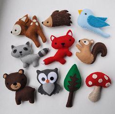 there are many felt animals on the table