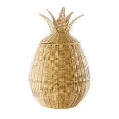 a wicker basket with a pineapple on the top and bottom, sitting in front of a white background