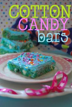 cotton candy bars on a pink and white plate