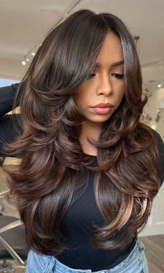 90 Blowout Haircut, Haircut For Bouncy Hair, Different Types Of Blowouts, Dark Hair Haircut Mid Length, Chocolate Brown Hair With Long Layers, Curly Hair Blowout Styles, Latina Blowout, Curtain Bangs With Volume, Blowout Hairstyles Medium Length