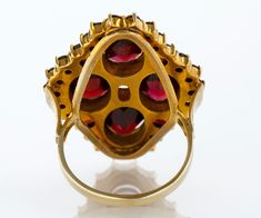 "Garnets come in many colors, but the most widely known is the rich dark red. This antique treasure of a ring features both round and oval garnets, prong and bezel set in 14 k yellow gold. Quite the statement ring, and you certainly don't need to be a January baby to love it! Antique Ring - Antique 14k Yellow Gold Garnet Statement Ring 14k Yellow Gold Garnet Ring Size 7 Ring measures approximately 1-1/8\" from top to bottom. back of band is 1.9mm wide. Please read our shop policies prior to purc Antique Ruby Ring With Multi-stone, Victorian Oval Ruby Ring In Yellow Gold, Yellow Gold Garnet Multi-stone Ring, Multi-stone Garnet Ring In Yellow Gold, Oval Multi-stone Garnet Rings, Yellow Gold Garnet Ring With Rose Cut Diamonds, Victorian Oval Ruby Ring With Prong Setting, Gold Garnet Ring, January Baby