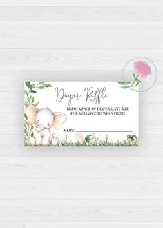 a baby elephant diaper raf card on a white wooden background with pink flowers and green leaves