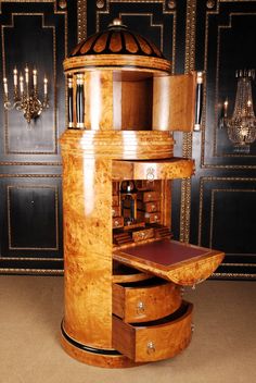 an unusual wooden desk with drawers in a room