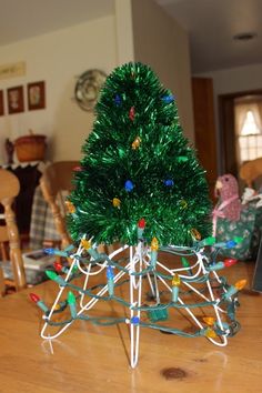 a small christmas tree on a wooden table