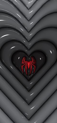 a heart shaped object with a spiderman symbol on it's center surrounded by black and red lines