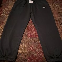 New! Mens Nike Sportswear Fleece Lined Elastic Ankle Sweatpant. Black Color Way. Mens Size Xl Waist 17.5 Inseam 30.25. Drawstring Waist And Two Hand Pockets. Pristine Condition. See All Photos Black Sports Sweats With Pockets, Black Sweats With Pockets For Sports, Comfortable Nike Streetwear Pants, Comfortable Nike Pants For Streetwear, Comfortable Nike Sweatpants For Sports, Comfortable Streetwear Nike Pants, Comfortable Nike Activewear For Jogging, Black Fleece Sweatpants Sportswear, Black Fleece Joggers For The Gym