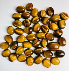 tiger's eye beads are shown on a white surface