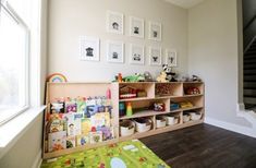 This DIY Montessori toy shelf is perfect for displaying your child's toys for them to easily see everything on the shelf and also put toys back easily. Shelves For Toys, Montessori Toy Shelf, Woodworking Plans Shelves, Playroom Shelves, Montessori Bookshelf, Diy Montessori Toys, Montessori Shelf, Toy Shelf, Diy Bookshelf