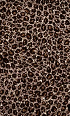 an animal print pattern is shown in brown and black