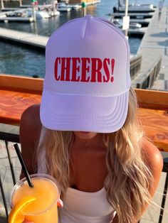 Our favorite cheers! trucker hat is perfect for this summer. You can dress it up or down and it will elevate your outfit! *THINGS TO NOTE* + Our trucker hats are made from 100% polyester with an adjustable mesh backing, making the hats both breathable and easy to find your perfect fit. + Orders only include trucker hat + One size fits most! + Message us for custom requests! Summer Trucker Hat With Flat Brim, Spring Beach Trucker Hat, 5-panel, Trendy Summer 5-panel Snapback Hat, Trendy 5-panel Snapback Hat For Summer, Trendy 5-panel Summer Baseball Cap, Fun Summer Baseball Cap With Curved Brim, Summer Trucker Hat With Snapback, Summer Trucker Snapback Hat With Letter Print, Fun White Baseball Cap For Vacation