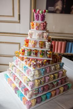 a large stack of candies sitting on top of a table