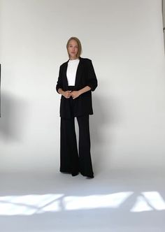 Crafted from soft ponte knit, this oversized blazer strikes the perfect balance between "relaxed" and "chic," offering effortless style without the worry of wrinkles. Designed to seamlessly transition from boardroom meetings to backyard dinners, it features self-lined lapels and deep pockets for both function and sophistication. The ideal piece to pair with our wide-leg or straight-leg pants, this blazer brings versatility and elevated style to any occasion. CLICK HERE FOR PANT Chic Oversized Blazer With Suit Collar, Modern Evening Blazer, Chic Evening Outerwear With Pressed Crease, Tailored Versatile Workwear Blazer, Tailored Versatile Blazer For Work, Tailored Versatile Blazer For Business Casual, Timeless Black Structured Blazer, Fall Evening Pantsuit With Pressed Crease, Fall Tuxedo Blazer For Workwear