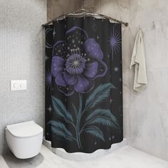 a black and purple flower shower curtain in a bathroom