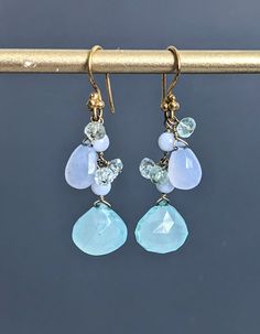 "Faceted Teardrop Chalcedony, Blue Lace Agate and Aquamarine Earrings, Gold Filled Sterling Silver (Vermeil) Wire Cluster Stick Earrings.  Earrings are 1 3/4\" ( 45 mm.) from top of the ear wire to the very bottom gold saucer bead.   Nice gift for her!  * Processing time is 3 - 5 days.  * US orders are shipped first class mail. * International orders are shipped first class international. * Shipping upgrades are available at checkout. Thank you for visiting my listing! Have a wonderful day!" Blue Briolette Wire Wrapped Earrings, Blue Chalcedony Dangle Jewelry, Blue Gemstone Teardrop Dangle Earrings, Blue Drop Earrings With Gemstone Accents, Blue Gemstone Accented Drop Earrings, Blue Drop Earrings With Natural Stones, Applying Perfume, Cluster Jewelry, Stick Earrings