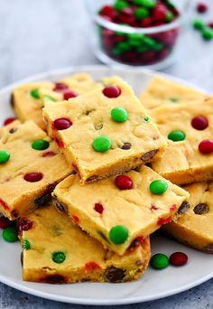 a white plate topped with pieces of cake mix fudges next to candy canes