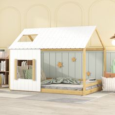 a child's bedroom with a bed and bookcases in the room,