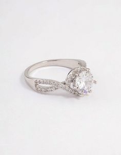 a white gold ring with an oval cut diamond