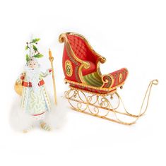 a santa claus sleigh with a christmas tree on top and a doll in it