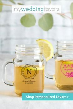 two mason jars filled with lemonade and tea sit next to each other on a table