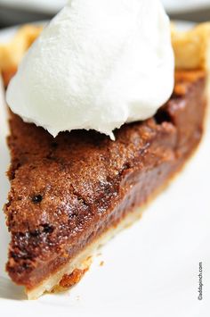 a piece of pie with whipped cream on top