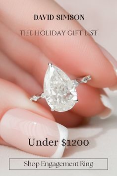 a woman's hand holding an engagement ring with the words under $ 1200