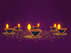 five lit candles on a purple background