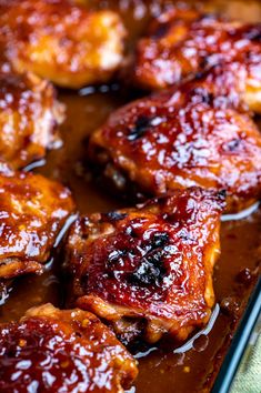 closeup of chicken wings covered in bbq sauce