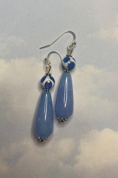 These earrings are inspired by the unique Tibetan Leopard Agate Beads. I love the unique blues and whites! The gorgeous sky blue teardrop bead is also agate.  Tibetan Agate enhances~ Strength  Courage  Cleansing Power  WEAR IN GOOD HEALTH! Blue Agate Earrings As A Gift, Hypoallergenic Blue Teardrop Pendant Earrings, Handmade Blue Agate Earrings, Blue Dangling Beads Teardrop Earrings, Bohemian Blue Drop Earrings, Blue Bohemian Drop Earrings, Blue Teardrop Drop Earrings, Blue Beaded Drop Earrings, Blue Hypoallergenic Adjustable Teardrop Earrings