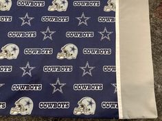 the cowboys are all over this bed sheet that is made to look like football helmets