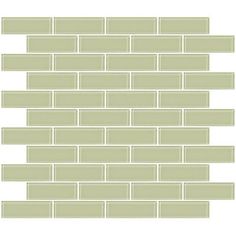 a green brick wall with white trim