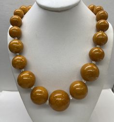 "Beautiful Antique Art Deco Marbled Bakelite Yellow Butterscotch Round Graduated Bead Necklace and past the test good pre/owned condition measures 26\" length and weight 71 grams perfect to add in your collection." Polished Beads For Formal Gems And Cabochons, Vintage Amber Jewelry With Large Beads, Amber Round Beaded Jewelry, Round Amber Jewelry With Large Beads, Amber Jewelry With Large Round Beads, Brown Polished Beads Round Necklace, Amber Jewelry With Large Beads, Brown Polished Bead Round Necklaces, Brown Necklaces With Polished Beads