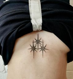 a woman with a star tattoo on her back