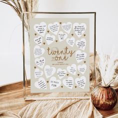 there is a glass frame with hearts on it and the words twenty one written in different languages