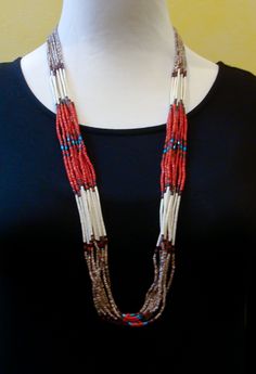 "Heishi Necklace, Santo Domingo Coral Turquoise Onyx 10 Strand Necklace, Native American Jewelry - This Santo Domingo heishi necklace is handcrafted with bright Turquoise, Coral, Pin Shell, and Onyx! This is that grand 10 strand accessory that will enhance your casual or dressy wardrobe. Measures Approximately: 32.75\" Weight: 43 grams FREE SHIPPING IN THE USA Take a look at our entire collection of Native American Jewelry > > > https://etsy.me/2vkBBfU Thank you for shopping with Highway 66 Trea Artisan Multicolor Hand-strung Necklaces, Southwestern Multi-strand Necklaces With Large Beads, Southwestern Multi-strand Large Bead Necklaces, Southwestern Multi-strand Necklace With Large Beads, Hand-strung Multi-strand Turquoise Necklace Gift, Handmade Southwestern Long Necklace, Handmade Southwestern Style Long Necklace, Southwestern Multi-strand Polished Beaded Necklaces, Artisan Double Strand Necklace With Colorful Beads