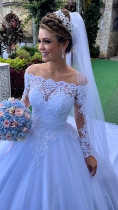 a woman in a wedding dress holding a bouquet