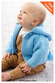 a baby sitting on the floor wearing a blue knitted jacket and brown pants with text overlay that says free knitting pattern storybook baby hoodie