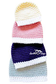 three knitted hats stacked on top of each other