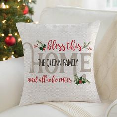 a christmas pillow sitting on top of a couch