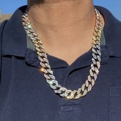 Men's 24" long x 15 mm thick Cuban link hip hop chain necklace. Stunning tritone yellow gold and rose gold finish over alloy metal core. Chunky neck piece weighs a hefty 138 grams. Cuban links nicely iced with vivid round-cut stones that shine bright. Chain has a stylish and secure box lock clasp. Stand out from the crowd with this colorful three colors iced cuban hip hop chain. Check us out! Gold Iced Cuban Link Jewelry, Iced Gold Cuban Link Jewelry, Chain Link Necklace With Bling For Gifts, Gold Iced Out Jewelry For Gift, Gold Iced Jewelry Gift, Iced Cuban Link Necklace For Gift, Bling Chain Necklace For Gift, Iced Out Rose Gold Necklace Gift, Ice Necklace