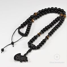 Men's Axe with Dragon Natural Tiger Eye Black Onyx Beaded Protection Long Adjustable Healing Gemstone Macrame Necklace Gift For Him Unisex -ALL THE PRODUCTS AT ELISAJEWELRYART ARE HANDMADE AND MADE WITH NATURAL BEADS. -WHAT DOES THE ONYX STAND FOR A powerful protection stone, Black Onyx absorbs and transforms negative energy, and helps to prevent the drain of personal energy. Black Onyx aids the development of emotional and physical strength and stamina, especially when support is needed during Adjustable Hand-strung Black Necklaces, Adjustable Black Hand-strung Necklace, Adjustable Hand-strung Black Necklace, Adjustable Black Beaded Necklaces With 8mm Beads, Adjustable Black Hand-strung Beaded Necklaces, Adjustable Black Necklace With 8mm Beads, Protection Stones, Tiger Eye Stone, Macrame Necklace