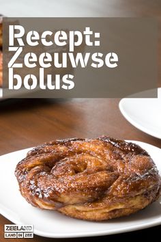 a close up of a doughnut on a plate with the words receipt zeeeuwse bolus