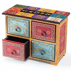 multicolored painted wooden box with drawers on top and one open drawer at the bottom