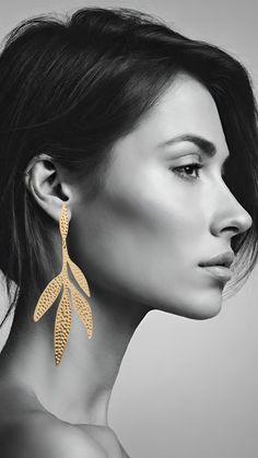 Introducing our Hammered Gold Leaf Earrings, a stunning display of craftsmanship. These earrings boast intricate detailing, crafted from premium materials with a brass base. Each pair is adorned with robust gold plating, creating a radiant and enduring brilliance. To guarantee lasting durability, we apply a meticulous transparent coat over layers of luxurious gold plating. These gold leaf earrings are meticulously crafted for the woman who seeks to highlight her individuality, reflecting her unique personality. Designed for those open to new experiences and fashion, they embody a timeless elegance that complements a woman's distinctive style. Elevate your look with these long, gracefully hanging earrings, making a bold statement that resonates with your one-of-a-kind essence. Drop length: Transparent Coat, Gold Leaf Earrings, Star Earrings Stud, Hammered Gold, Hanging Earrings, Heart Studs, Heart Earrings Studs, Artistic Jewelry, Leaf Earrings