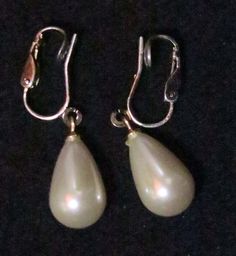 Elegant Imitation Pearl Earrings, 3/4 inch long Please view the attached photos to see this items condition and other information. wvs: 4705 Formal Costume Jewelry Clip-on Drop Earrings, Classic Metal Dangle Clip-on Earrings, Metal Clip-on Earrings With Ear Wire For Formal Occasions, Classic Pearl Drop Dangle Clip-on Earrings, Formal Metal Clip-on Earrings With Ear Wire, Affordable Elegant Clip-on Pearl Earrings, Antique Clip-on Pearl Earrings For Formal Occasions, Vintage Clip-on Pearl Earrings For Gift, Luxury Vintage Clip-on Pearl Earrings