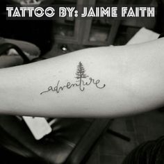 a person with a tattoo on their arm that reads,'adventure'in cursive writing